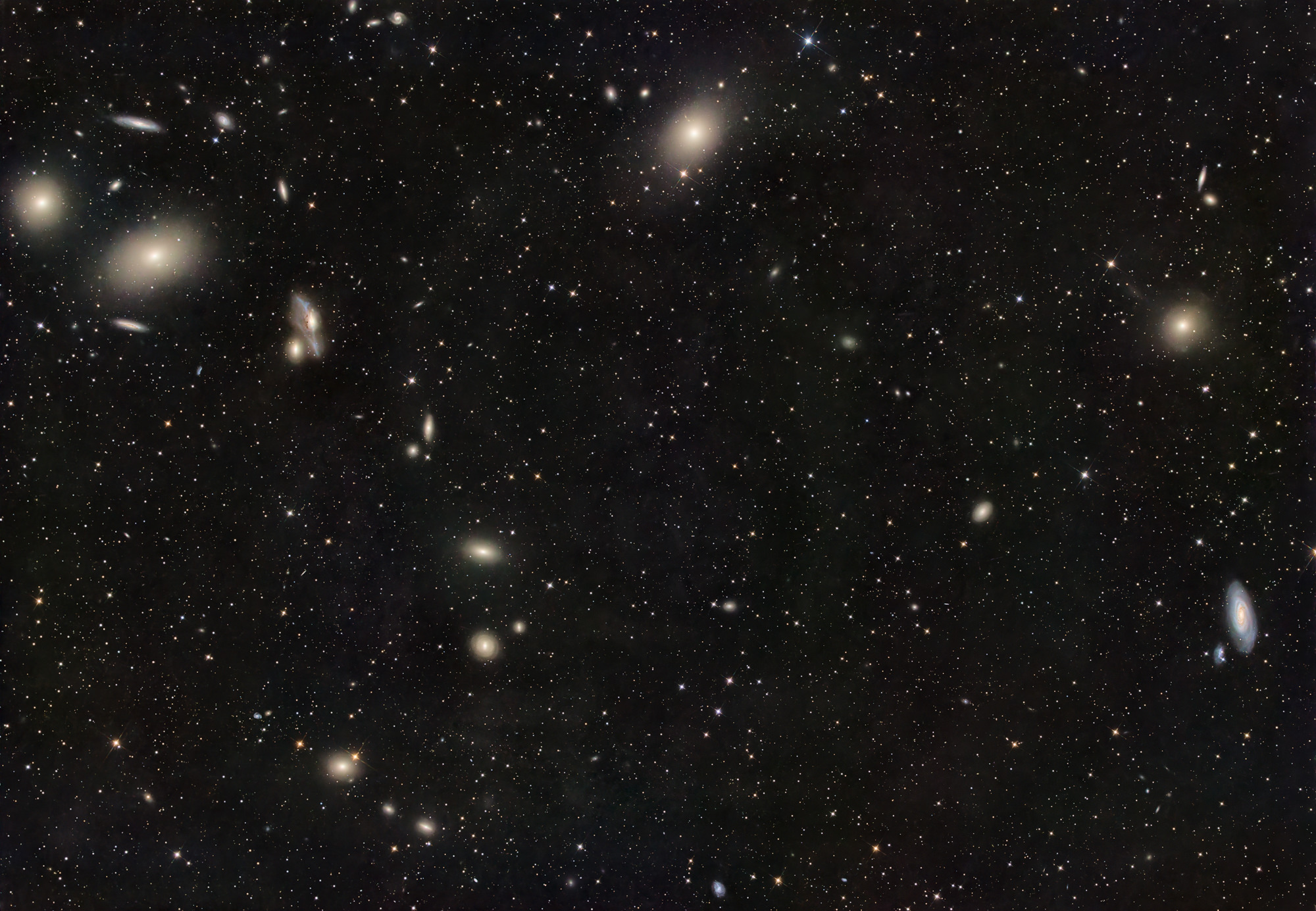 The arc-shaped galaxies of the Markarjan Chain with the galaxies Messier 84 and Messier 86 at the top left, the galaxy Messier 87 at the top-middle and the two galaxies Messier 89 and Messier 90 on the right are located in the constellation Virgo.